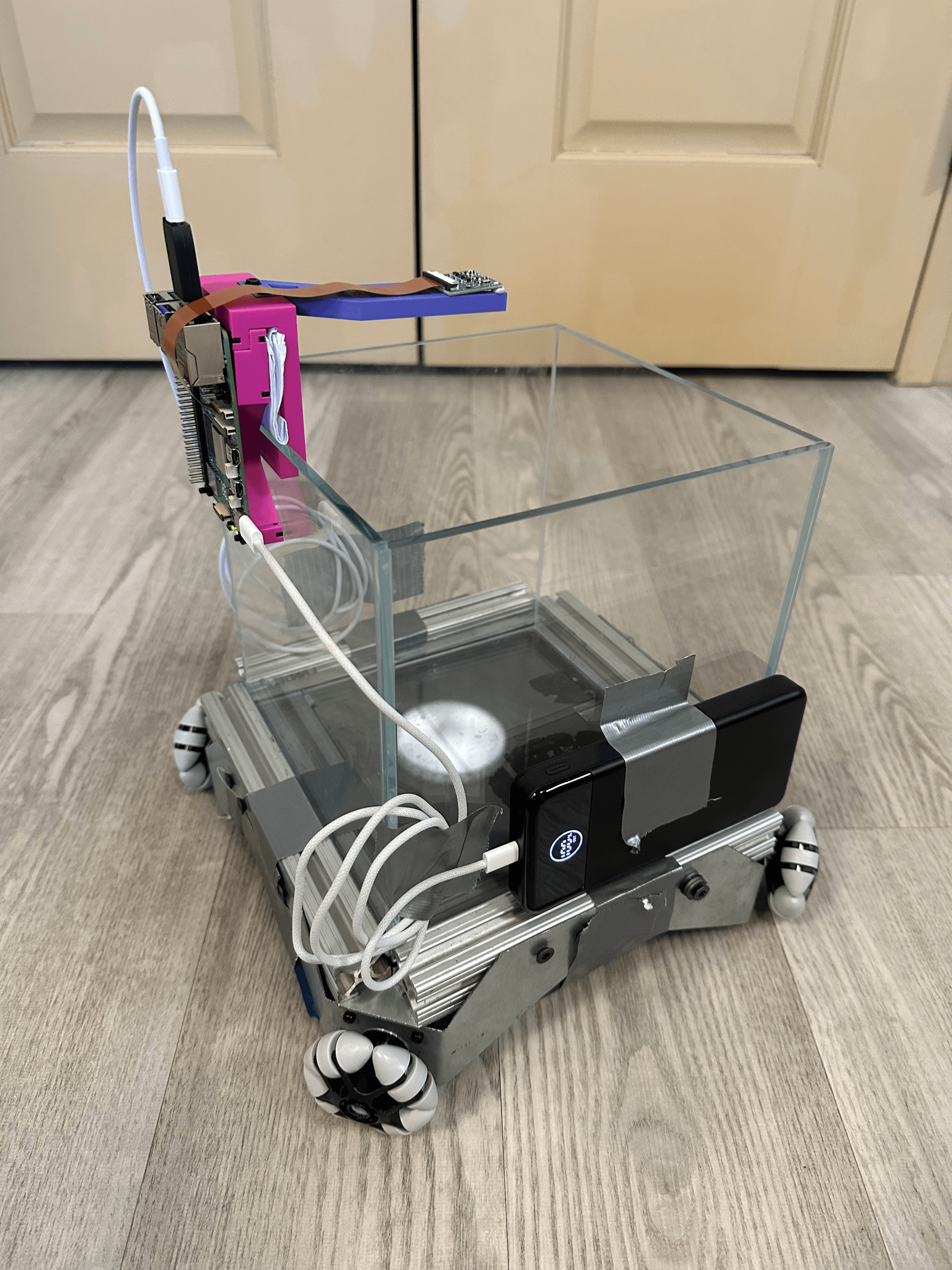 A picture of a fish tank on a wheeled platform